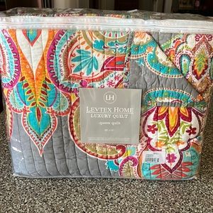 Colorful queen size quilt.  Brand new